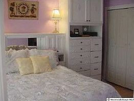 Master Bedroom with built in wall cabinets