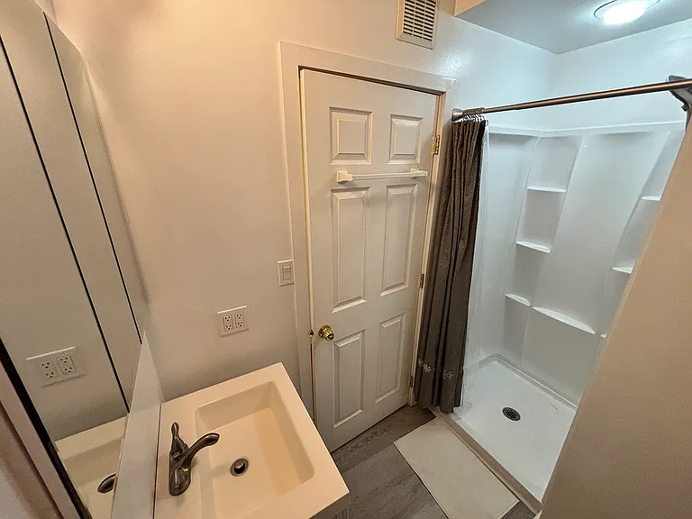 Bathroom with walk in shower.