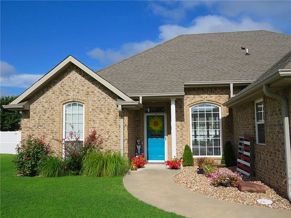 Eye-catching front landscaping and door.