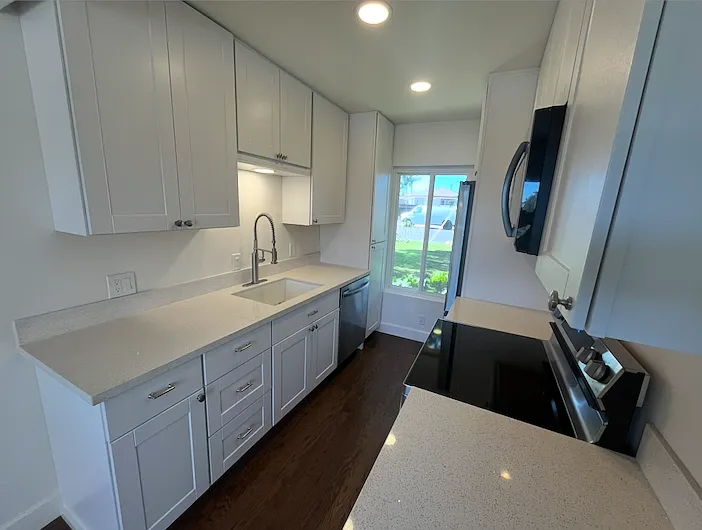Brand new kitchen with all new appliances, fridge, microwave, stove, and dishwasher.