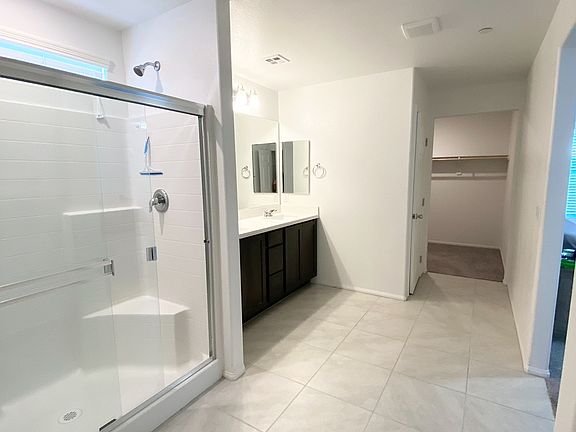 Master Bathroom with his and her walk-in closet
