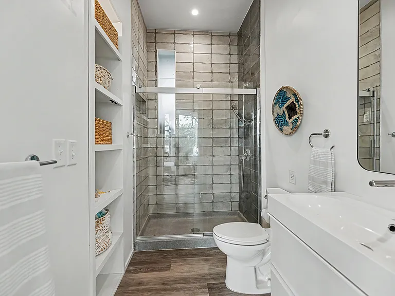 Main level full bathroom with walk-in shower