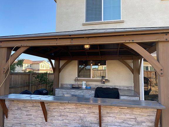 Backyard with custom built outdoor kitchen