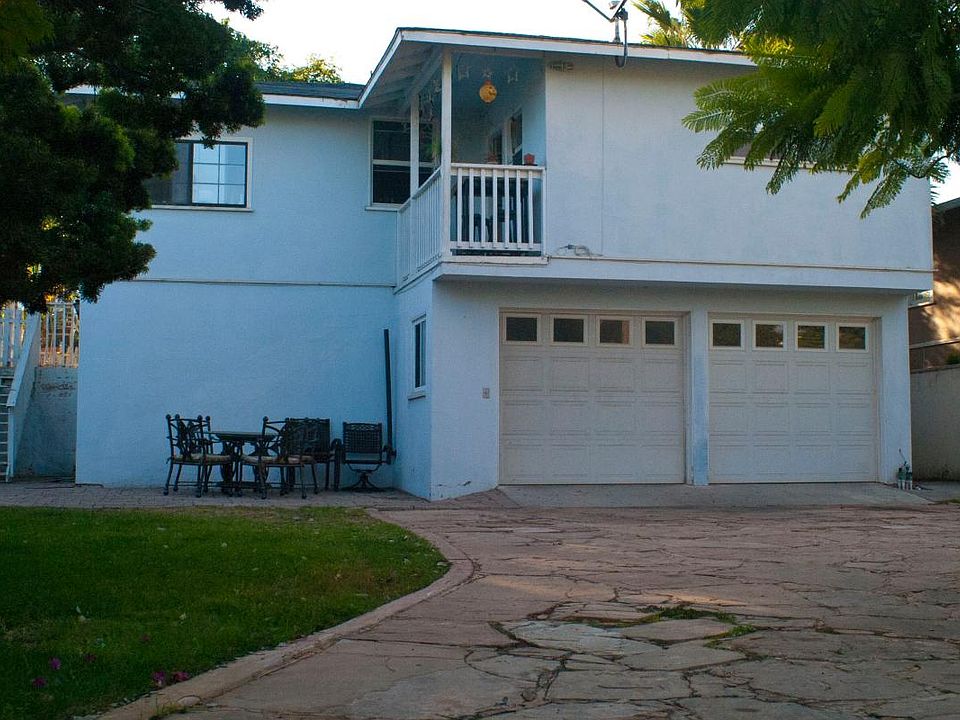 2-car garage and long flagstone driveway