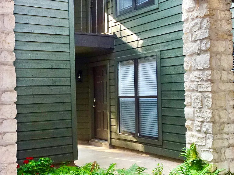 Look up to unit 207, shares one wall with neighbor.