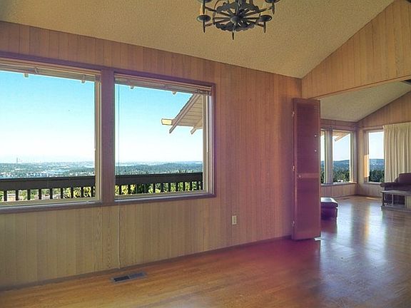 Remodel ideas; Open up the entry foyer by removing the fireplace