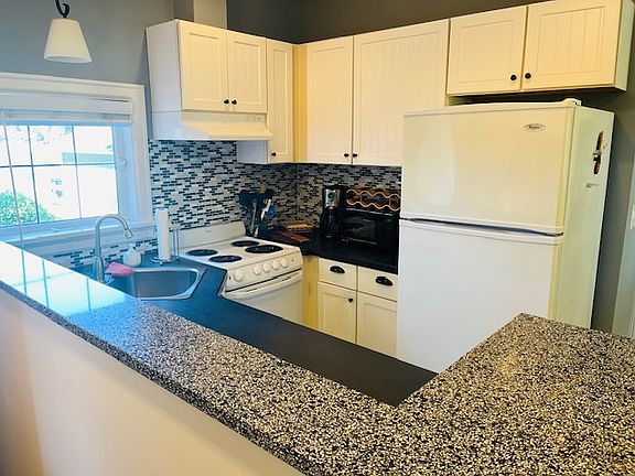 Kitchen with coffee maker and microwave