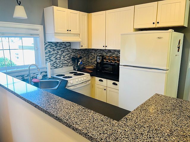 Kitchen with coffee maker and microwave