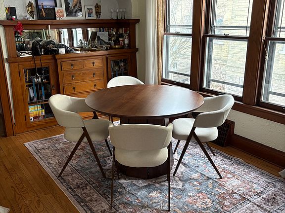 Dining room. Built-in china cupboard w/stained glass doors and sconce lights.