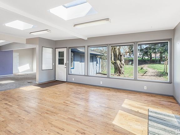 Huge windows and skylights for tons of natural light. French doors lead to the large deck.