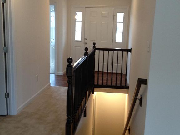 Beautiful Entry With Wood Railing