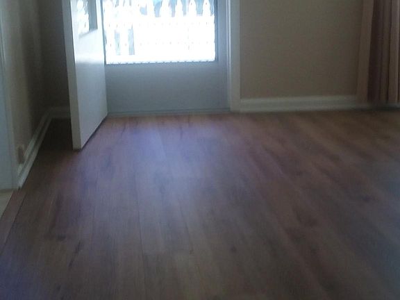 Living Room. New flooring. Fresh Paint. New Heater.