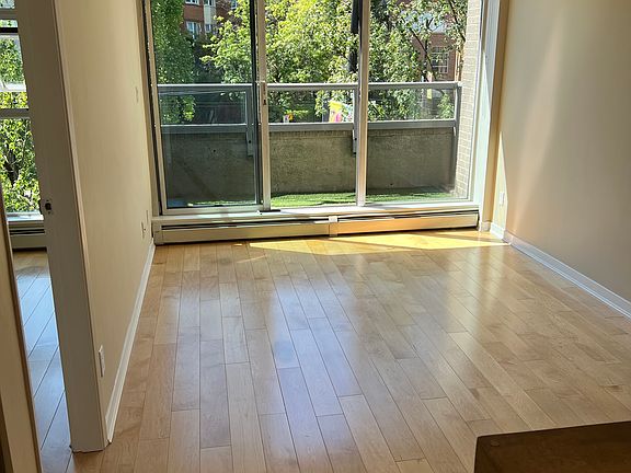 View from the kitchen to the lounge and out onto the balcony.