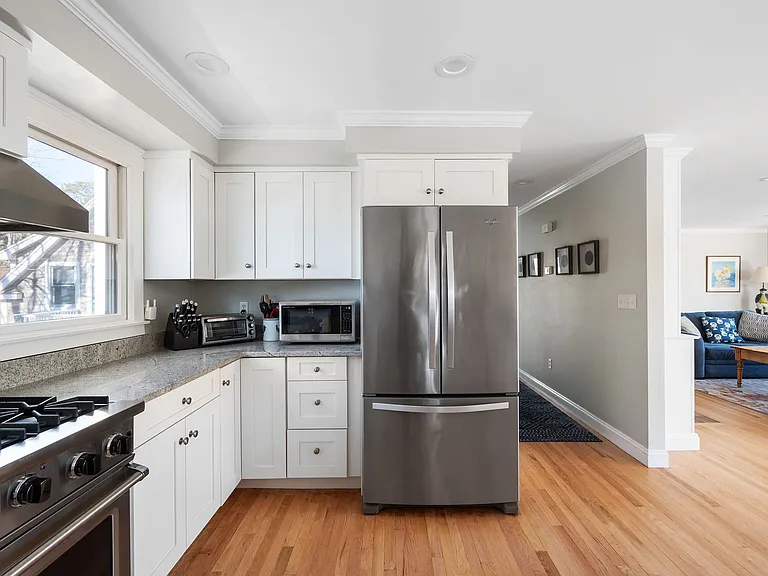 Kitchen with bar seating, Viking stove, and all the kitchen items you'll need.