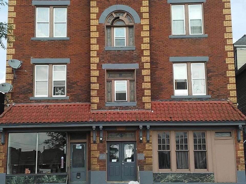 Louisa Apartments 7 units plus barbershop. Street parking on