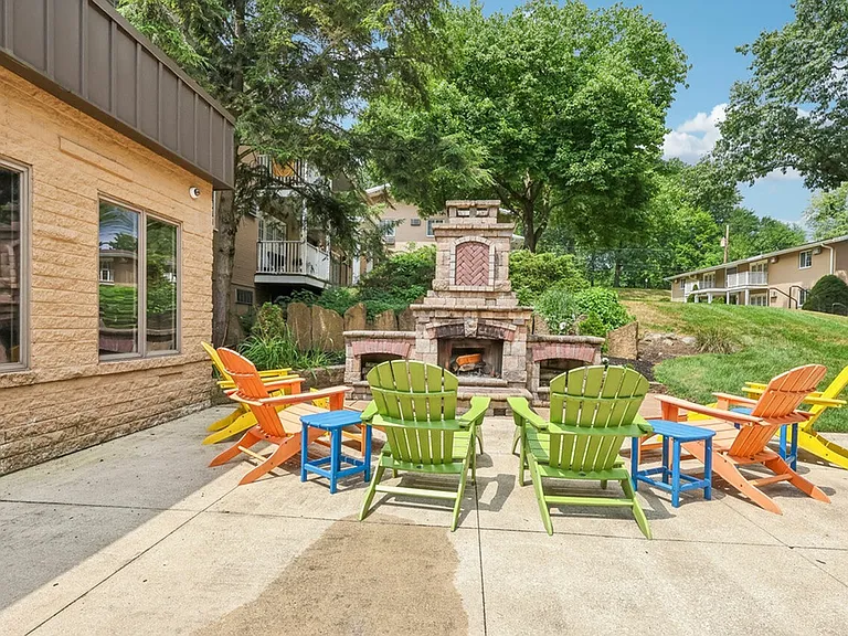 Gather around the outdoor fireplace and relax at University Oaks Apartments near Kent State University.