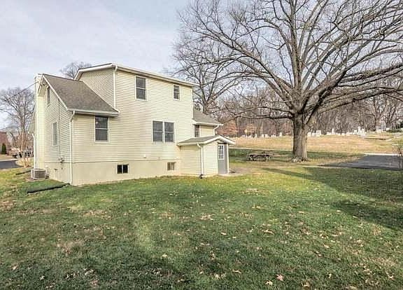 Back of home, basement door to washer and dryer