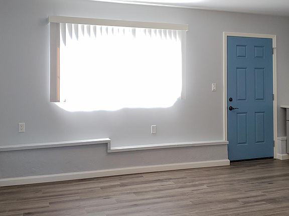 Your living room with great light and deluxe faux wood flooring.