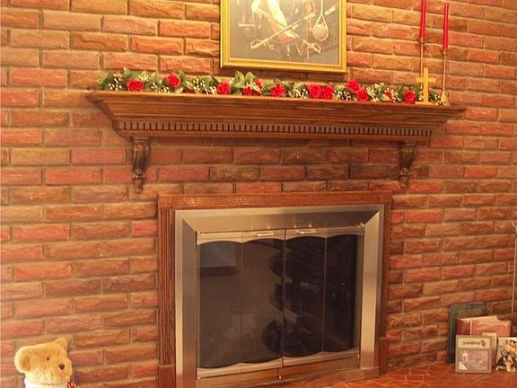 "The custom oak mantle offers the perfect finishing touch."