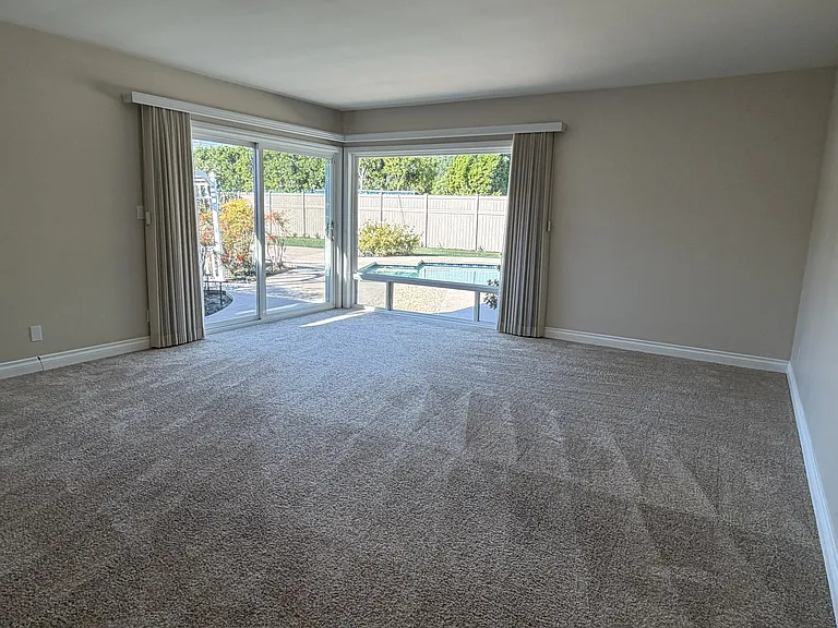 Primary bedroom with pool view