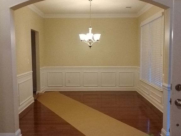 Taped down paper is to prevent the waxed floors from being scuffed.