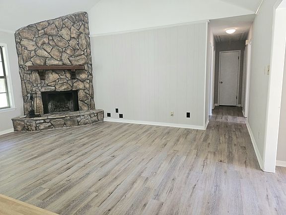 Living room view from kitchen. Lovely fireplace.
