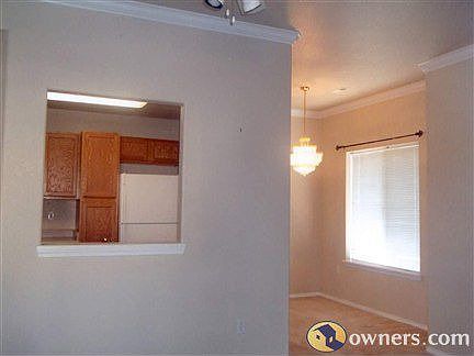 Kitchen window and dining room, seen from living area
