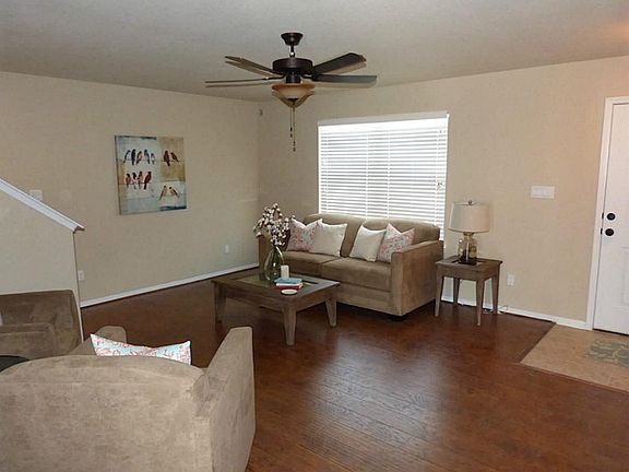Entry opens to a large living area or could be family game room! You decide! Mini blinds & laminate wood flooring!
