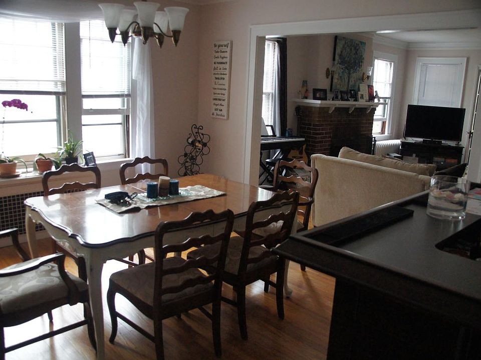 Dining room with view of living room fire place