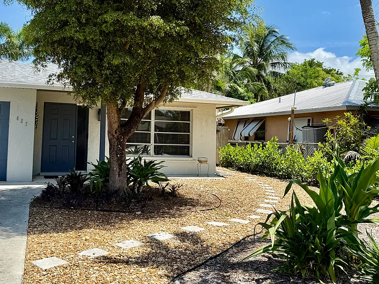 Gorgeous landscaping, driveway fits 2 cars