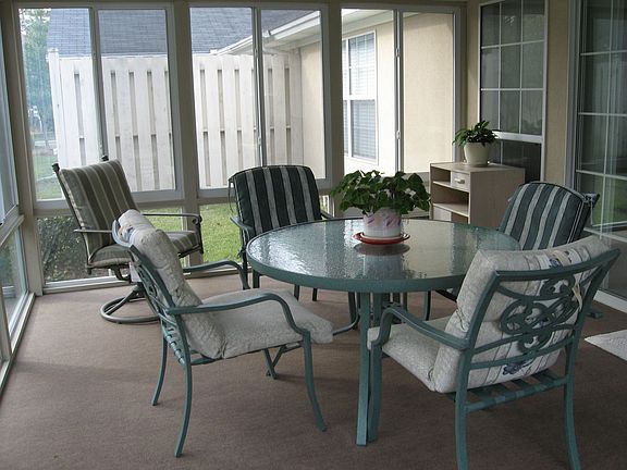 Relax in the Sunroom Complete with Insulated Windows and A/C!