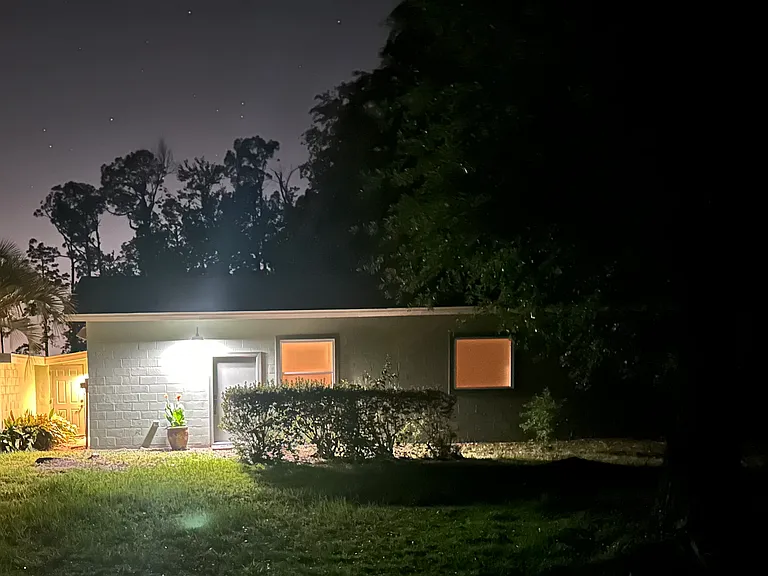 Photo of front Entrance in evening lights with outdoor lighting.