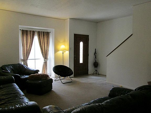 The front door opens into the large living room/dining room combination,.