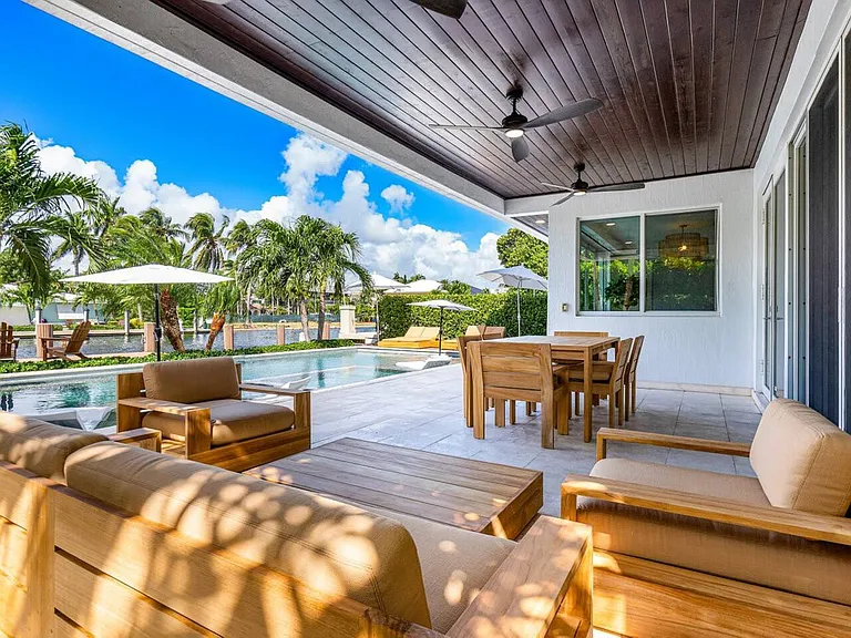 Lounge in shaded comfort with seamless indoor-outdoor flow.