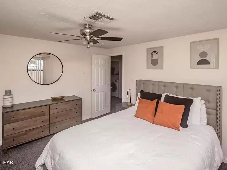 Bedroom 2 with dresser and mirror.