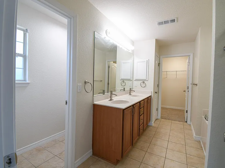 Master bathroom with private toilet room, linen closet & walk-in closet