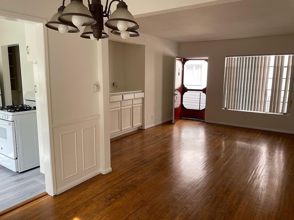 Living room from the dining room- newly done hardwood floors and ceiling fan