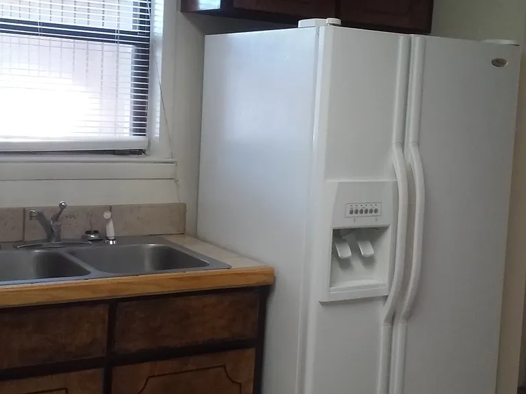 Kitchen with side by side refrigerator- water and ice in the door