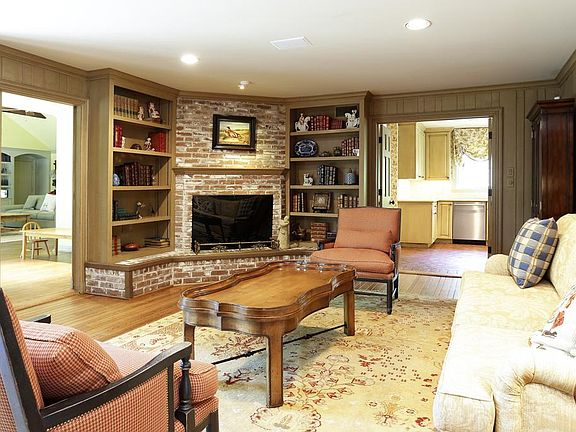 This cozy den/living room opens to a larger den or downstairs gameroom with kitchen access also. Sec