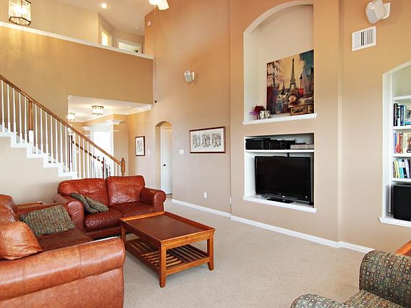 Vaulted ceilings reaching a height of 18' in the Den.  The Den also boasts beautiful built-ins!
