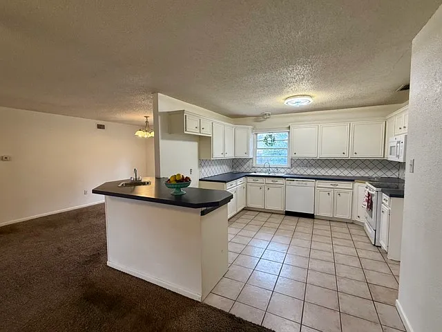 View of the kitchen and dining room.