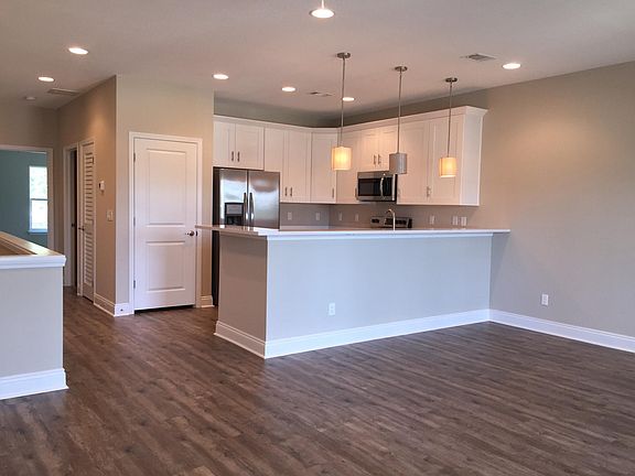 Open floor plan for kitchen, living room, & dining.