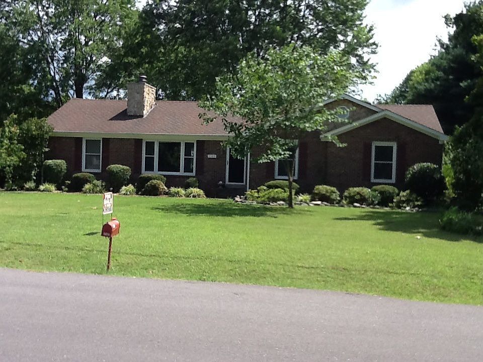 All brick on 1/2 acre