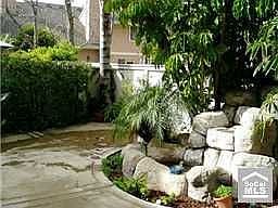 Lovely yard to relax by the waterfall