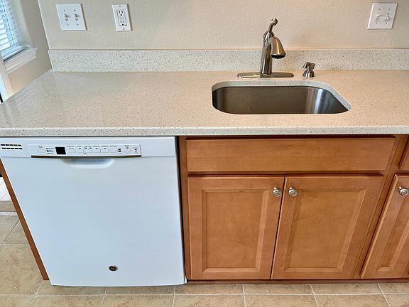 Dishwasher and deep stainless steel sink