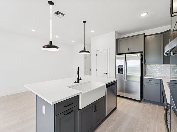 Kitchen with white apron-front sink