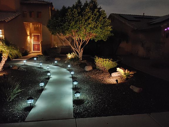 Front door, lighted entry path with Security door.