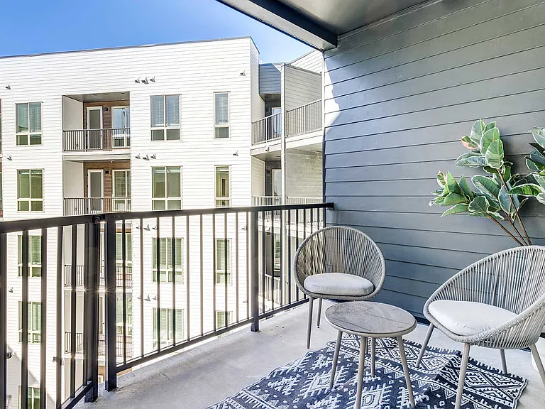 Enjoy fresh air, morning coffee, and quiet moments from a private balcony designed to extend your living space outdoors.