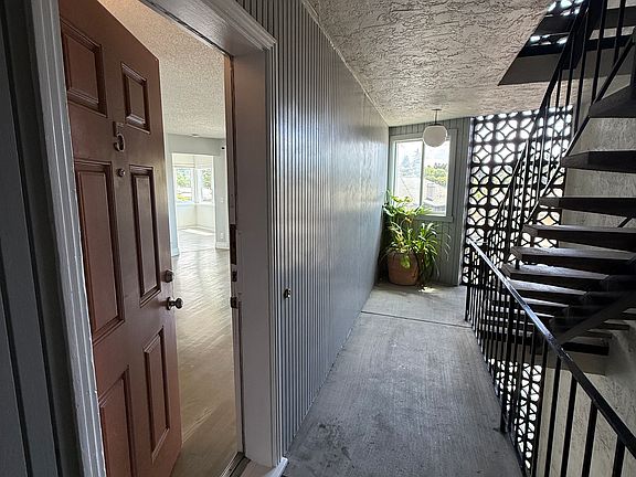 staircase and hallway to apartment