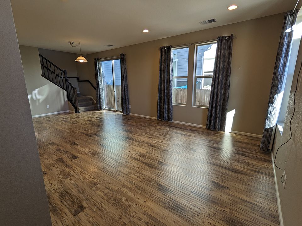 Spacious living room with hardwood floors